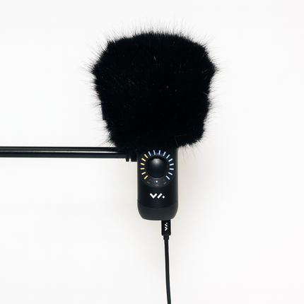 Black microphone with windscreen on a white background