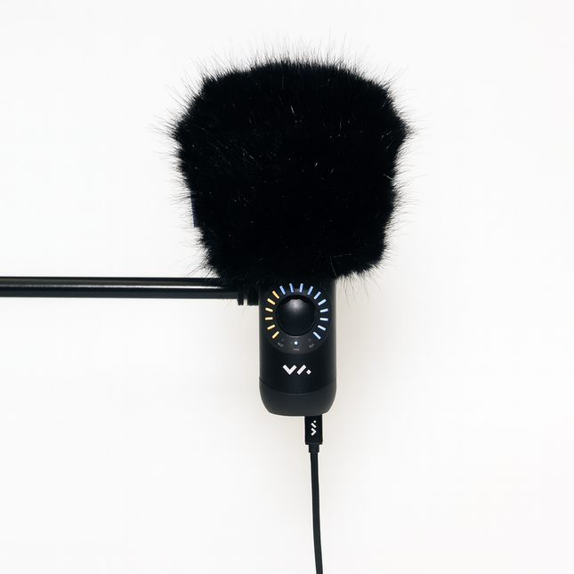 Black microphone with windscreen on a white background