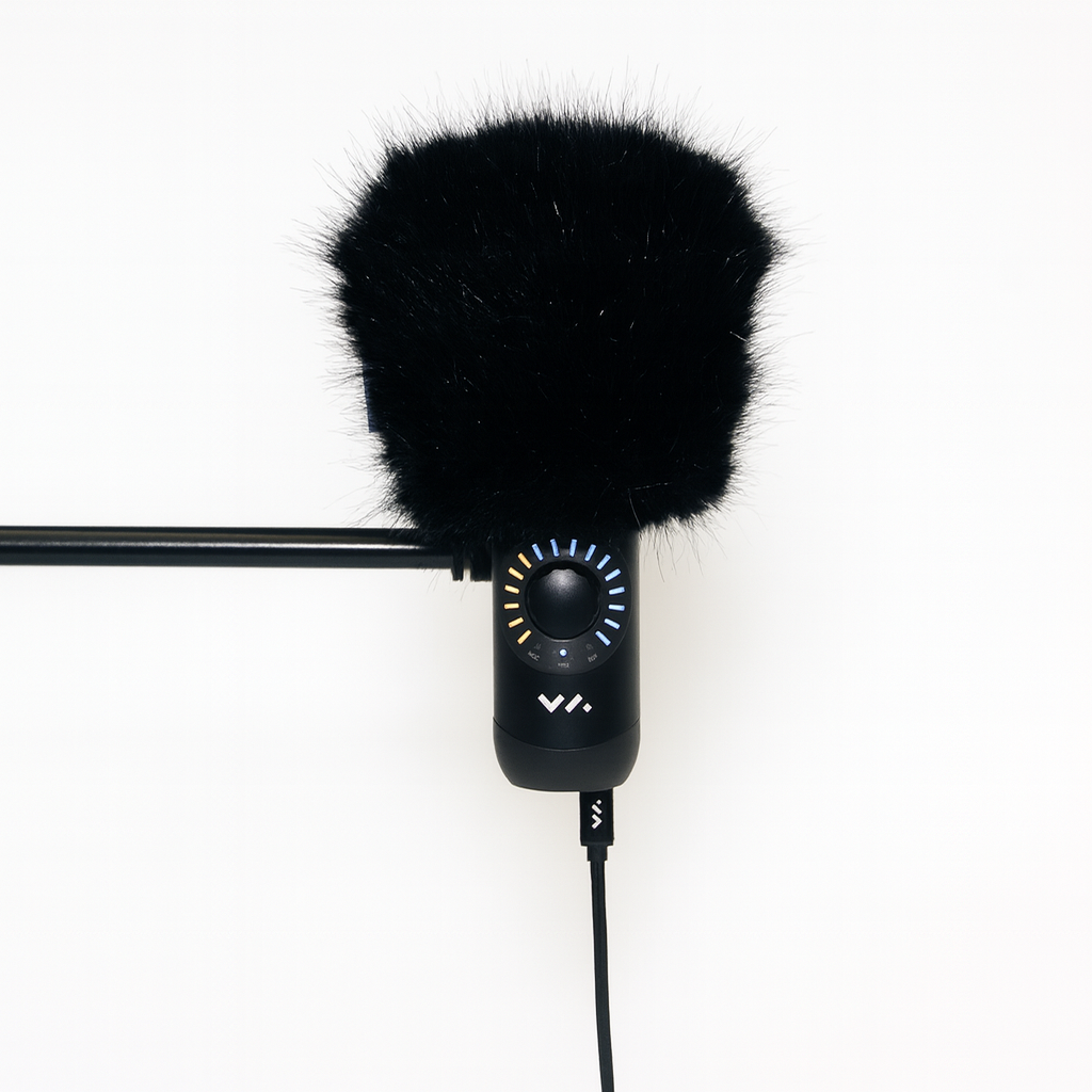 Black microphone with windscreen on a white background